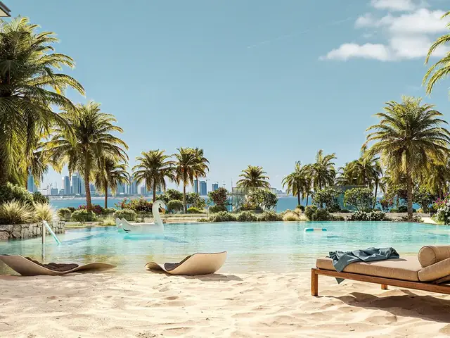 Private beach with loungers and palms