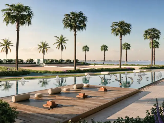 Infinity pool deck lined with palms