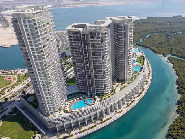 Three Radisson Residences towers on the Al Reem Island waterfront, aerial view
